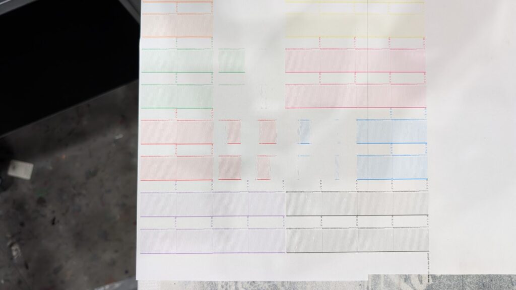 Clogged BombyxJet print heads shown during a nozzle check on the printer.